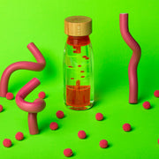 Sensorische Petit Boum fles - Move Bottle Spiral Pink - Sensorisch speelgoed Petit Boum - In den Olifant